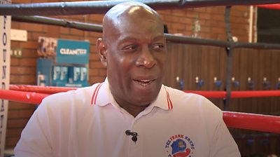 The boxing champion launches a community centre offering wellbeing support after his own struggles.