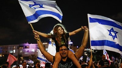 Many Israelis celebrate as a new coalition government ends 12 years of Benjamin Netanyahu.