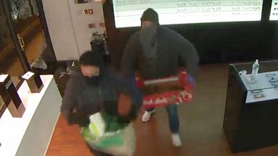 CCTV footage has captured two men robbing an eyewear store in Sloane Square.
