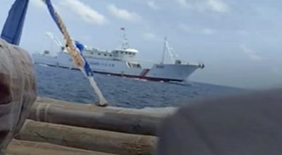 The view of a Chinese Coastguard ship from a Filipino fishing boat