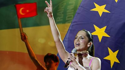 Composite picture of Turkish singer Sertab Erener, flag of Turkey, flag of EU and LGBT rainbow flag