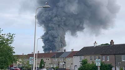 A giant column of smoke could be seen for miles on after a fire broke out at a premises in Bellshill, North Lanarkshire.