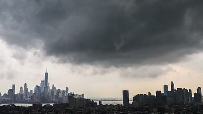 New York skyline with a storm cloud hovering over it