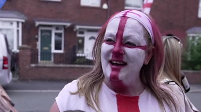 Woman with England flag face paint