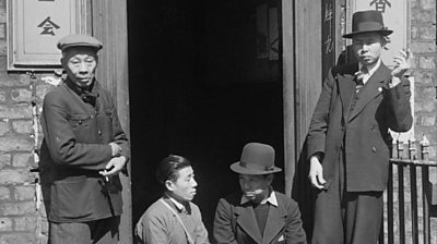 A group of Chinese seamen outside a Chinese hostel in Liverpool, May 1942. 