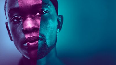 Close up on main character from Moonlight's face (Chiron Harris as an adult). Have a blue filter on it and a downward narrow triangle of purple down the centre of his face.