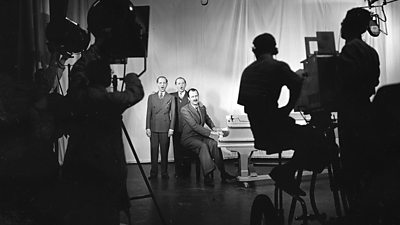 Singing trio The Three Admirals in front of piano. August, 1936.