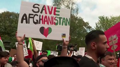 "Save Afghanistan" banner at protest