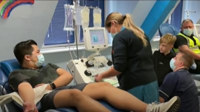 Plasma donor meets children helped by donations