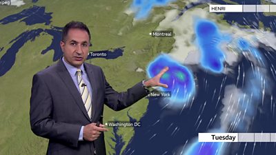 Stav Danoas points out Henri on the weather map