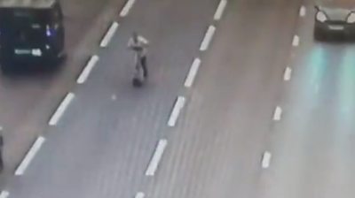 Man rides scooter on motorway