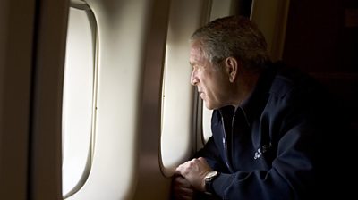 Former US President Bush looking out of a window as Air Force One flew over the Hurricane Katrina-devastated New Orleans