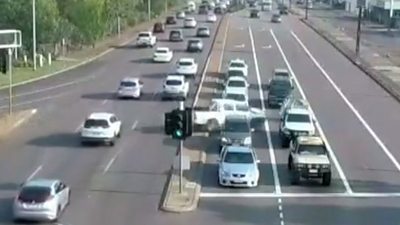 car crossing lanes of traffic
