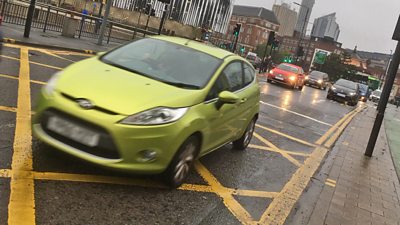 File photo: Cars on a rainy day in Leeds