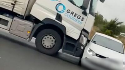 Video posted online shows a passenger in another car on the M1 trying to make the HGV driver aware.