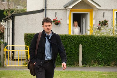 James Thornley (KERR LOGAN), Amanda Wilkinson (MIKA SIMMONS) in Showtrial (Image Credit: BBC/World Productions Photographer: Joss Barrett)