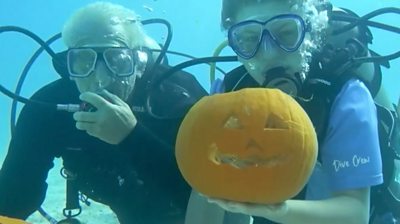Divers with their pumpkins