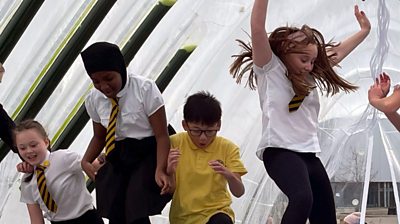 Children jumping in a playground