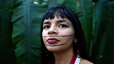 Activist Txai Surui in the rainforest
