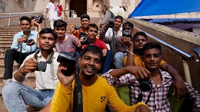 Photographers posing outside the temple