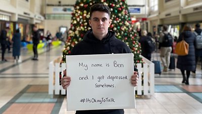 Ben standing in Leeds station