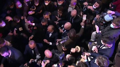 Eric Zemmour grabbed as he walks through crowds at a rally