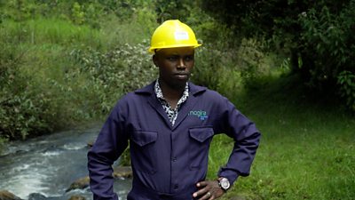 John Magiro standing next to Gondo River