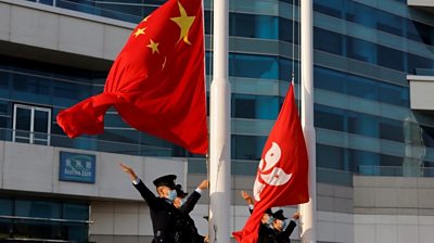 Police raise Chinese and HK flags