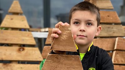 Noah sells model trees and other wooden structures as decorations and has big dreams for the future.