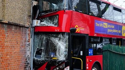 Three children and two adults have been taken to hospital after a double-decker bus hit a shop in north-east London.