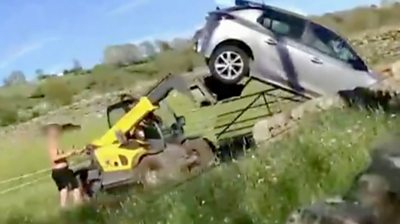 Farm vehicle flipping car