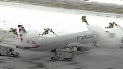 Plane being de-iced