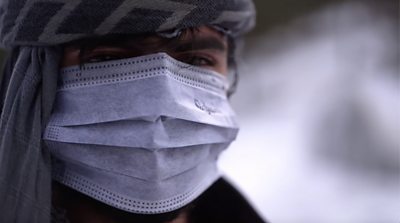 Man in Afghanistan with a face mask