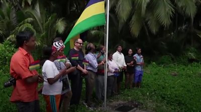 Mauritian flag being raised at Chagos Islands