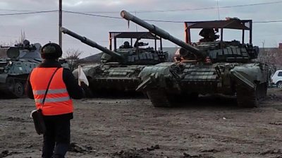 In footage released by Russia's defence ministry, troops appear to be packing up some military equipment.