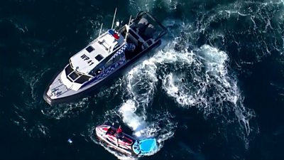 Police boat and jet ski search for shark