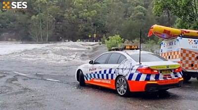 Police car near flood water