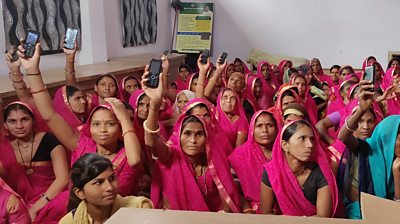 Women in a self-help group show their mobile phones. Even though India is the world's largest market for social media platforms, users are overwhelmingly male. Photo credit: Sara Chamberlain, BBC Media Action.