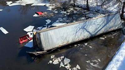 Watch the moment a tractor-trailer plunged 50ft into the water after crashing off a bridge.