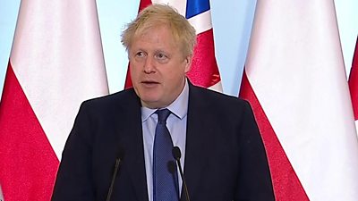 Boris Johnson speaking at press conference in Warsaw, Poland