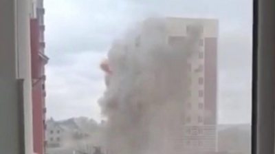 Dust cloud surrounds apartment block