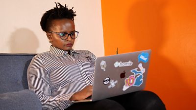 Angela Mugo on her laptop