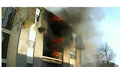 A brave father threw his son, 3, from the window of a burning building down to first responders.