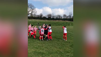 Goalkeeper Charlie Clarke celebrates with his teammates after scoring