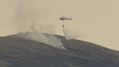 Plumes of smoke billowed into the sky as firefighters tackled the blaze