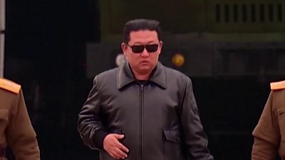 North Korea leader Kim Jong-un wearing a black leather jacket and sunglasses