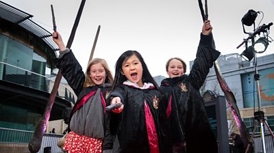 Children holding wands
