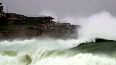 Waves crash on cliff at Bondi