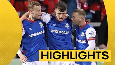 Linfield players celebrate victory at Seaview
