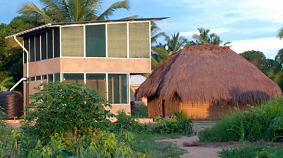 Star home next to traditional home.